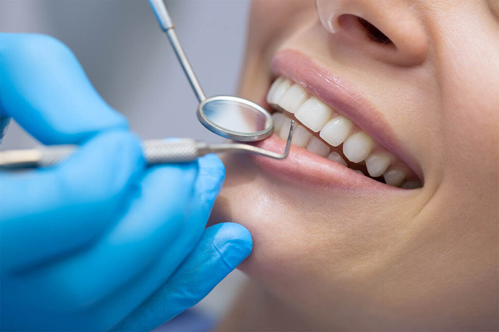 Close-up of a dental implant examination highlighting the precision and care in implant dentistry services.